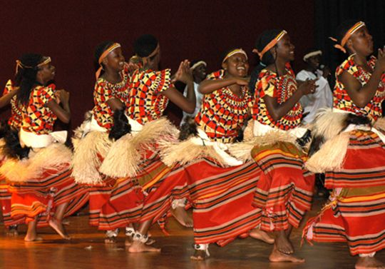 Ugandan men and women dancing
